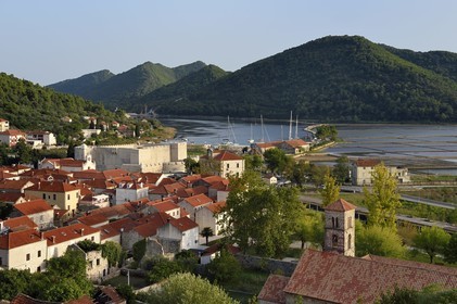 Croatia, Dalmatia, peninsula of Peljesac, the old town of Ston, Fort Kastio on the left and the Saint-Nicolas monastery on the right, the ancient salt marshes in the background