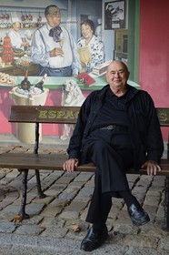 France, Rhone, Collonges au Mont d'Or, L'Auberge du Pont de Collonges Paul Bocuse Restaurant, three Michelin stars since 1965, famous French chef Paul Bocuse in front of the painted wall portraying French chef Fernand Point and his wife