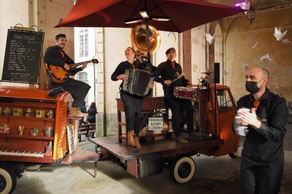 France, Meurthe-et-Moselle, Nancy, place Stanislas (former Place Royale) during the feast of Saint-Nicolas, listed as World Heritage by UNESCO, the Accords Léon group under the Arc de Triomphe (Porte Héré)