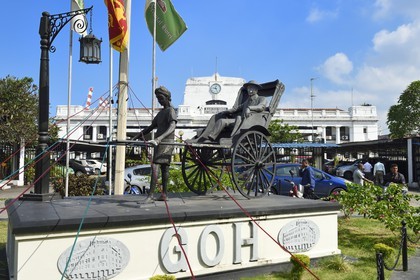 Sri Lanka, Western Province, Colombo District, Colombo, the commercial port, statue of the arrival in rickshaw of the writer Anton Chekhov at the Grand Oriental Hotel, the port authority building in the background