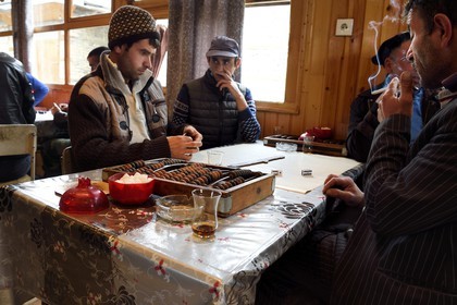 Azerbaijan, Ismailli region, Lahij (Lahic), domino players in the cafe