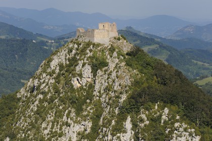 France, Ariege, Pays d' Olmes, Cathar Castle of Montsegur perched on a rock and the Pyrenees (aerial view)..