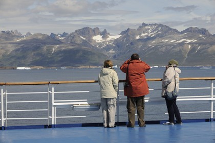Greenland, Southern Region, Princess Danae cruise ship passing icebergs off Nanortalik