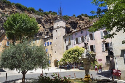 France, Var, Provence Verte, Cotignac, the Town Hall Square and the Clock tower below the tufa cliff of 80 meters high and 400 meters wide