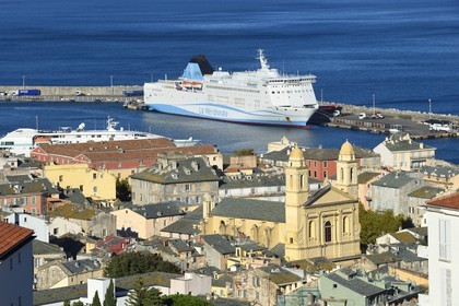 France, Haute Corse, Bastia, St Jean Baptiste Church and the commercial harbor in the background