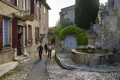 France, Vaucluse, Dentelles de Montmirail mountains,  Vaison la Romaine, the upper town (medieval city), the Hotel du Beffroi and the fountain on rue de l'Evêché