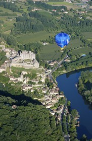 France, Dordogne, Perigord Noir, Beynac et Cazenac village, labelled Les Plus Beaux Villages de France (The Most Beautiful Villages of France), hot air balloon flying over the castle and Dordogne river (aerial view) .
