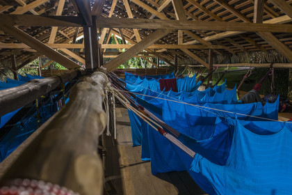 France, French Guiana, Kourou, the carbet (shelter) at Camp Maripas on the banks of the Kourou river, hammocks suspended under the rafters