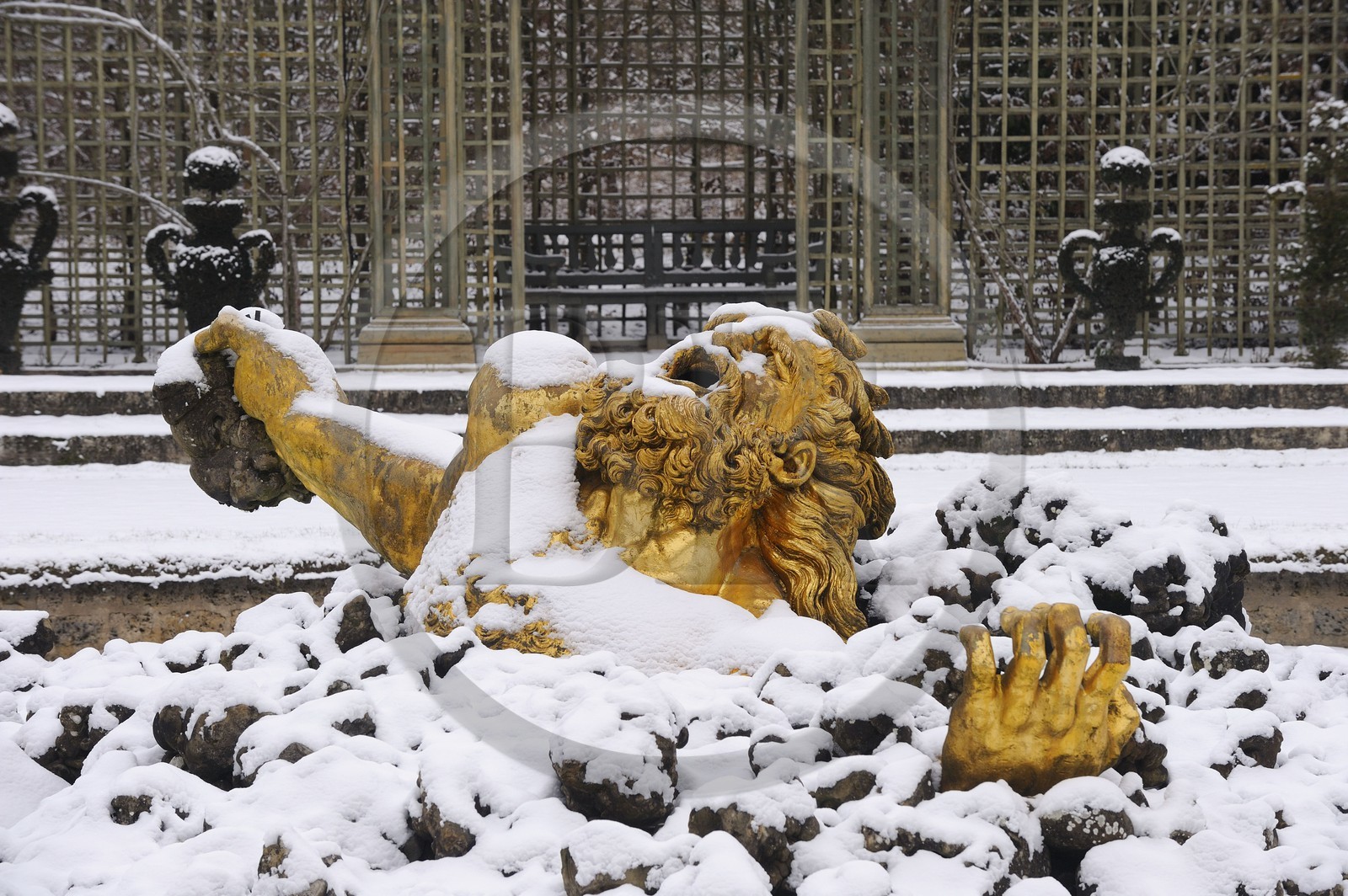 France, Yvelines, snow covered park of the Chateau de Versailles, listed as World Heritage by UNESCO, Bosquet de l'Encelade (Encelade Grove) by Marsy