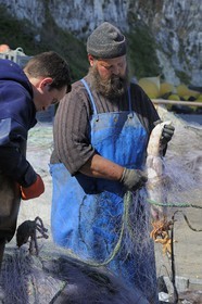 France, Seine-Maritime, Veules-les-Roses, fisherman retrieving the catch of the day of the nets