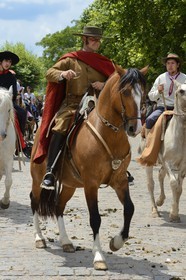 Argentina, Buenos Aires Province, San Antonio de Areco, Tradition Day festival (Dia de Tradicion), gaucho on horseback in traditional dress during the parade, estanciero (gaucho who owns a ranch)