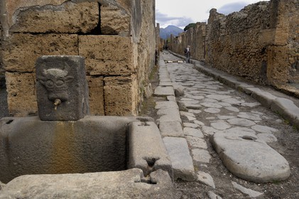 Italy, Campania, Pompei, archeological site listed as World Heritage by UNESCO, old paved street of the city