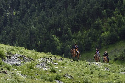 Georgia, Kakheti, Tusheti National Park, Alazani River Valley in the mountains of Pirikiti, riders on horseback