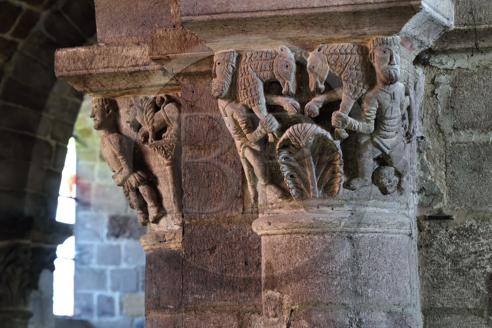 France, Haute Loire, Brioude, the Basilica of Saint-Julien de Brioude in Auvergne Romanesque style, carved capitals decorated with patterns, sheep carriers who bring animals to sacrifice