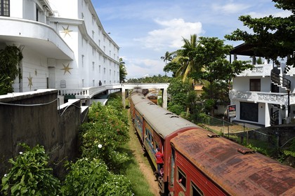 Sri Lanka, Western Province, Colombo District, Colombo, the Galle train passing in front of the Mount Lavinia Hotel