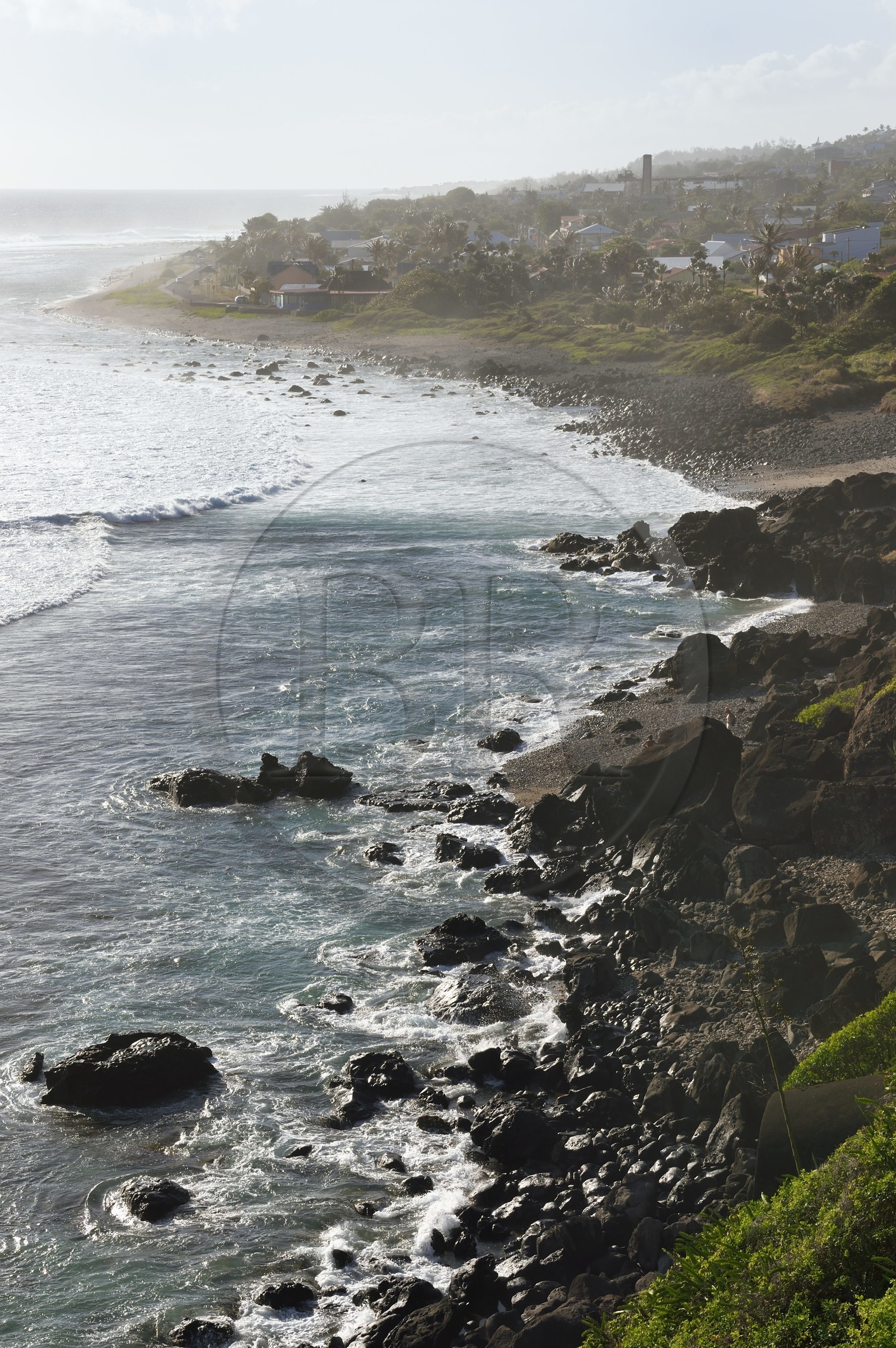France, Reunion island (French overseas department), Petite-Ile on the southern coast, Grand-Bois beach and rocks, the chimney of the old sugar factory in the background France, Reunion island (French overseas department), Petite-Ile on the southern coast, Grand-Bois beach and rocks, the chimney of the old sugar factory in the background