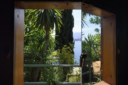 France, Alpes Maritimes, Roquebrune Cap Martin, architectural work of Le Corbusier, listed as World Heritage by UNESCO, Cap Martin, Cabanon (Shed) by Le Corbusier built in 1952, mirror games on window shutters (Authorization request necessary before publication)