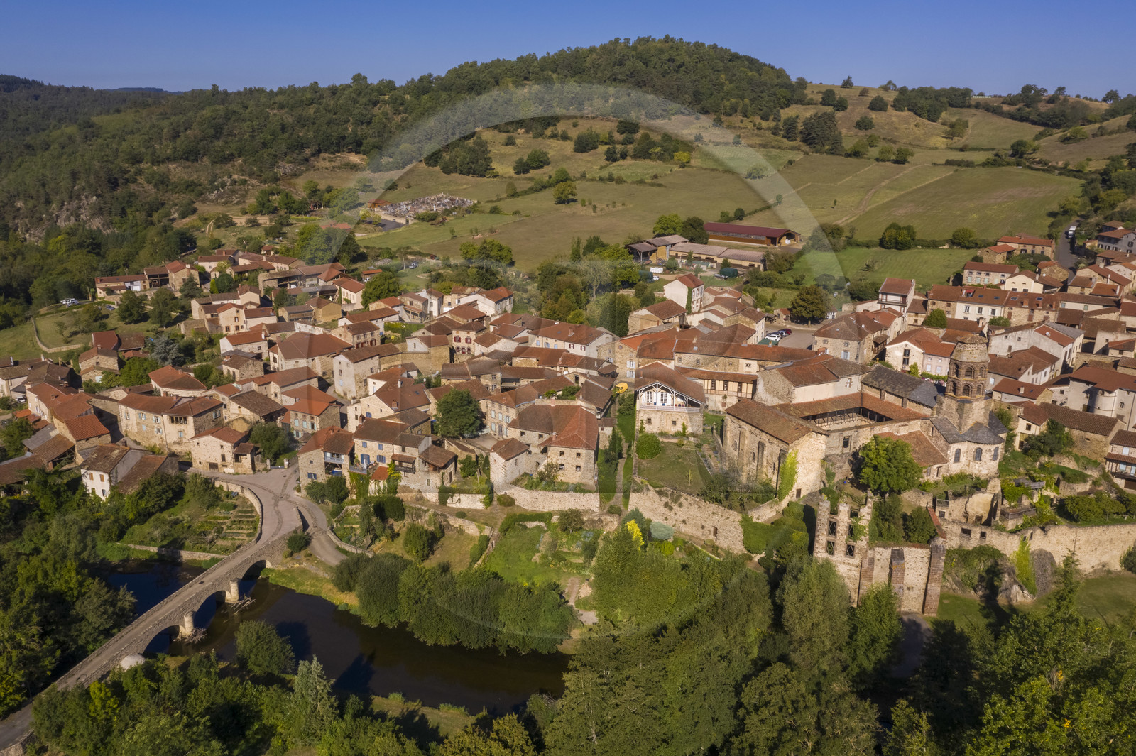 France, Haute Loire, Lavaudieu, labelled Les Plus Beaux Villages de France (The Most Beautiful Villages of France), the former Saint Andre (St Andrew) abbey in Auvergne Romanesque style and the old bridge over Senouire river (aerial view) France, Haute Loire, Lavaudieu, labelled Les Plus Beaux Villages de France (The Most Beautiful Villages of France), the former Saint Andre (St Andrew) abbey in Auvergne Romanesque style and the old bridge over Senouire river (aerial view)