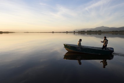 France, Haute Corse, the pond of Biguglia (Stagnu di Chiurlinu) at dawn, nature reserve of Corsica (RNC), Paul-Marie Ghipponi guard of the natural reserve of Corsica (RNC) patrolling the pond