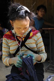 Vietnam, Lao Cai province, Sapa district, the Black Hmong minority group, sewing and blue indigo dyeing work