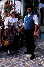 France, Haut Rhin, Eguisheim village, labelled Les Plus Beaux Villages de France (The Most Beautiful Villages of France), wine celebration, Alsatian couple in traditional costume