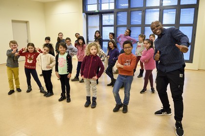 France, Bas Rhin, Strasbourg, old town listed as World Heritage by UNESCO, rehearsal of the Gospel Kids choir under the direction of choir master Alfonso Nsangu