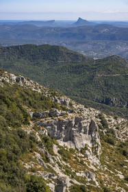 France, Herault, the Causses and the Cevennes, Mediterranean agro pastoral cultural landscape, listed as World Heritage by UNESCO, Montpeyroux, rocks and cliffs of Mont Saint Baudille, the Pic Saint-Loup facing the Hortus in the background