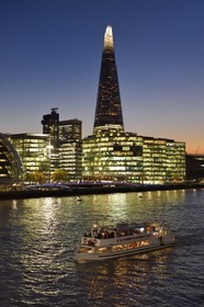 United Kingdom, London, Southwark district, London bridge quarter, boat on the river Thames in front of the More London Development and the Shard London Bridge Tower by architect Renzo Piano, the tallest tower in London