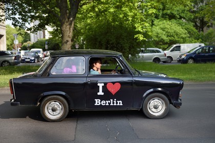 Germany, Berlin, Karl-Marx Allee is the largest artery of the country leading from Alexanderplatz to Frankfurter Tor and the communist regime annually paraded his army there, new look Trabant car