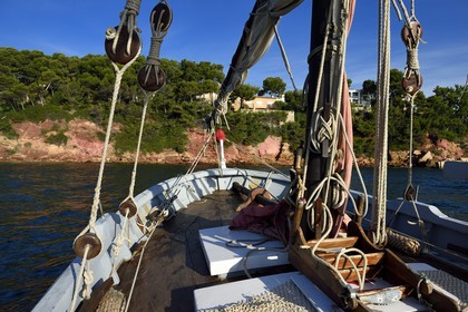 France, Var, Sanary-sur-Mer, Christian Benet who is president of the Sanary Pointus association aboard his eight-meter with Latin sail Pointu called Belle Brise