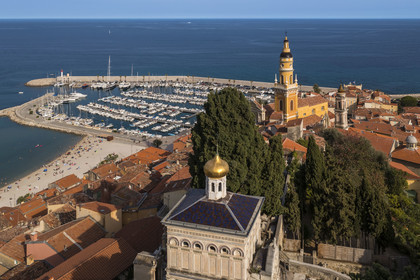 France, Alpes-Maritimes, Menton, old town, the Old Castle cemetery, marine cemetery, Orthodox chapel built in 1884 by Count-Protasov Bechmetieff, the Basilica of Saint Michel and the port in the background (aerial view)