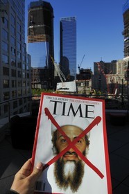 United States, New York, Manhattan, reconstruction at Ground Zero with the One World Trade Center (Freedom Tower), the Time magazine announcing the death of Bin Laden facing the site of the attacks of September 11, 2001 on the twin towers of the World Trade Center
