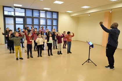 France, Bas Rhin, Strasbourg, old town listed as World Heritage by UNESCO, rehearsal of the Gospel Kids choir under the direction of choir master Alfonso Nsangu