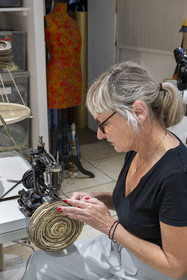 France, Cote d'Or, Dijon, milliner Sara Tintinger making a hat in her workshop-boutique Bibi & Bob on rue d'Assas, the hat is worked on velvet ribbon