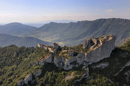 France, Aude, Peyrepertuse, the ruins of Cathar castle built in XIIth century and the castle of Queribus in shape in the background (aerial view)