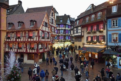 France, Haut Rhin, Colmar, wood-framed houses at the corner of rue des Marchands and Grand Rue with Christmas decorations
