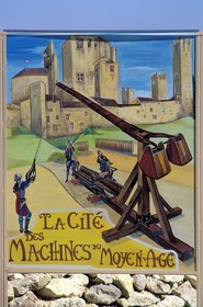 France, Gers, Larressingle village, advertising sign for the Middle Age war machine exhibition