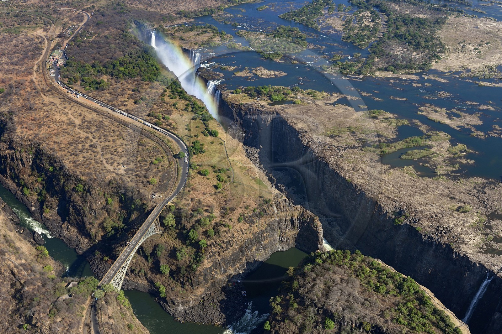 Zimbabwe, Matabeleland North Province,  Zambesi River, the Victoria Falls, listed as World Heritage by UNESCO, bridge that marks the border between Zimbabwe and Zambia (aerial view) Zimbabwe, Matabeleland North Province,  Zambesi River, the Victoria Falls, listed as World Heritage by UNESCO, bridge that marks the border between Zimbabwe and Zambia (aerial view)