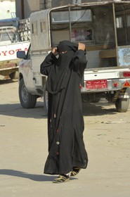 Egypt, Libyan Desert, Farafra, veiled woman