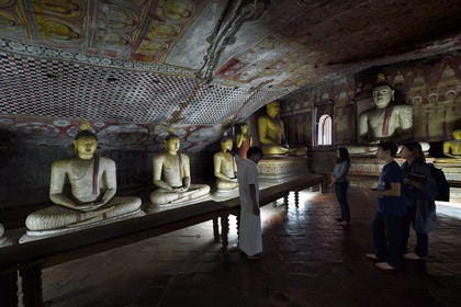 Sri Lanka, Central Province, Matale District, Dambulla, Cave temple, Royal Rock Temple also called Ran Giri (Golden Rock) listed as World Heritage by UNESCO, Cave 2 Maharaja Viharaya is the largest, seated Buddha with clasped hands cupped in dhyana mudra meditation position