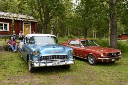 Sweden, Vasterbotten County, Umea, old vintage cars meeting in Gammlia park, 1955 Chevrolet (sometimes referred to as '55 Chevy) and Ford Mustang 289 from 1967-1968