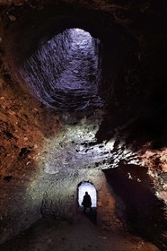 France, Puy de Dome, Clermont Ferrand, member of the ACAVIC association (Amis des Caves du Vieux Clermont) in the galleries dug in the basements in tuff of the Conservatory (former Lycée Blaise Pascal), aeration well at the top