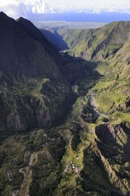 France, Ile de la Reunion, le cirque de Cilaos, classé Patrimoine Mondial de l'UNESCO, la route nationale 5 d'accès au cirque aussi appelée Route aux 400 virages et la côte ouest vers Saint-Louis en arrière plan (vue aérienne)