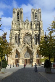 France, Marne, Reims, Notre-Dame de Reims cathedral, listed as World Heritage by UNESCO, the western facade and monk on the square