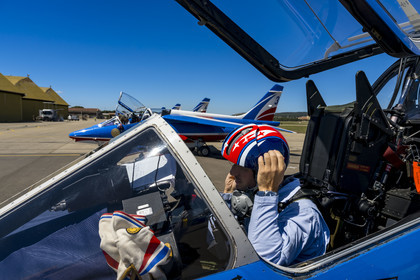 France, Bouches du Rhone, Salon de Provence, air base 701, base of the Patrouille de France (PAF for Patrouille acrobatique de France) of the French Air and Space Force, the pilot, Captain Cédric Queyranne, finishes preparing in his cockpit alongside adjudant Nicolas Renard, his mechanic, for a flight aboard his Alphajet aircraft