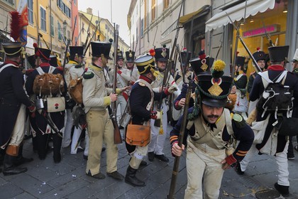 Italy, Liguria, Sarzana, Napoleon Festival, street battles between french soldiers of the Grand Armée and austrian soldiers in the main street Via Mazzini in the old town