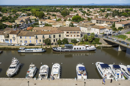 France, Gard, Aigues Mortes, the port of the Rhone to Sète canal at the foot of the ramparts of the old town