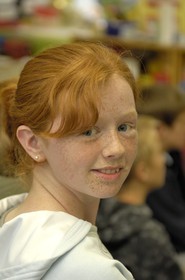 Republic of Ireland, County Galway, Aran Islands, Inishmore, Onaght, redhead girl at the village 's local school