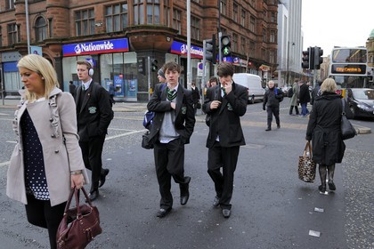 United Kingdom, Northern Ireland, Belfast, schoolchildren in uniforms after school on Donegall Square