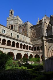 Spain, Extremadura, Guadalupe, Royal Monastery of Santa Maria de Guadalupe listed as World Heritage by UNESCO, Mudejar cloister built in the 15th century and the church in the background